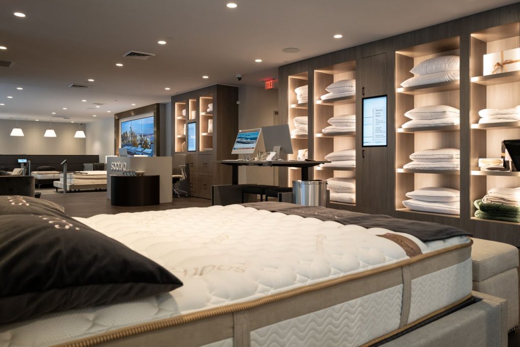 Saatva Seattle Viewing Room Entrance Desk Self Checkout Desk and Accessories Wall