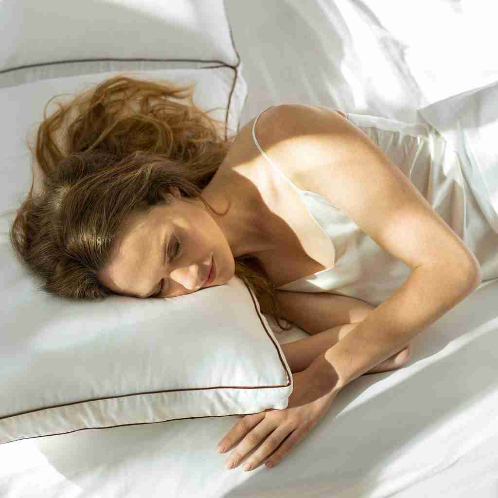 the saatva pillow lifestyle woman sleeping 1 1